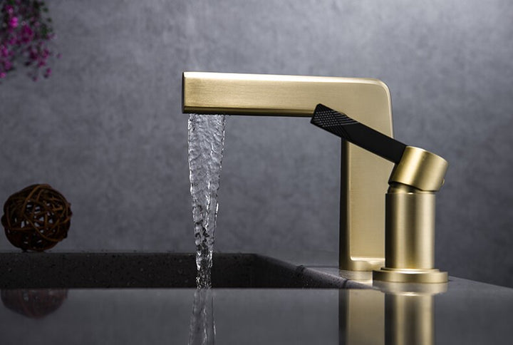 Black with brushed gold bathroom faucet