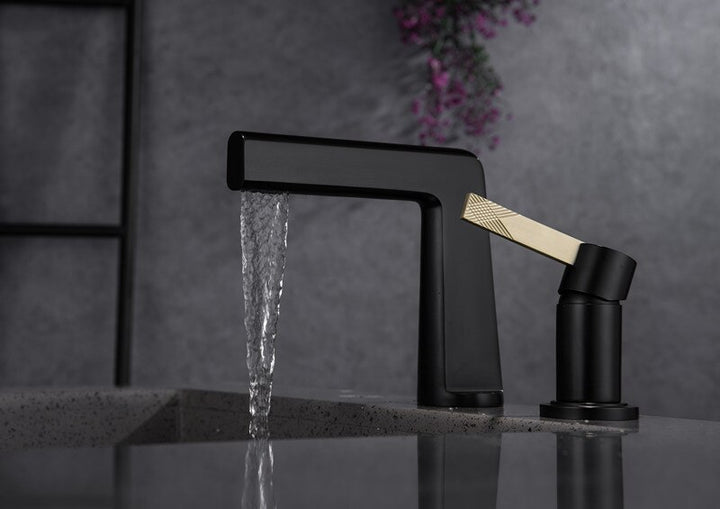 Black with brushed gold bathroom faucet